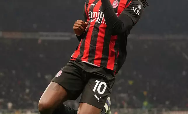 AC Milan's Rafael Leao celebrates after scoring the opening goal during the Serie A soccer match between AC Milan and Lazio, in Milan, Italy, Saturday, Nov. 29, 2025. (AP Photo/Antonio Calanni)