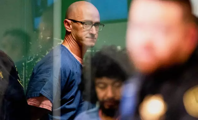 FILE - Joseph David Emerson, back, appears in Multnomah County Circuit Court for an indictment hearing in Portland, Ore., on Dec. 7, 2023. (Dave Killen/The Oregonian via AP, Pool, File)