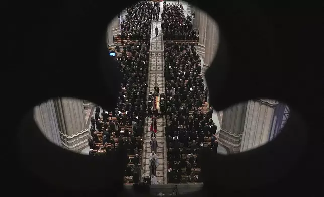 The casket with former Vice President Dick Cheney is carried out of the Washington National Cathedral after services, Thursday, Nov. 20, 2025 in Washington. (AP Photo/Matt Rourke)