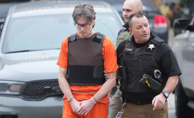 Curt Andersen, left, arrives at the Boone County Courthouse for a hearing on a voluntary manslaughter charge in the killing of Maria Florinda Rios Perez De Velasquez in Lebanon, Ind., Friday, Nov. 21, 2025. (AP Photo/AJ Mast)