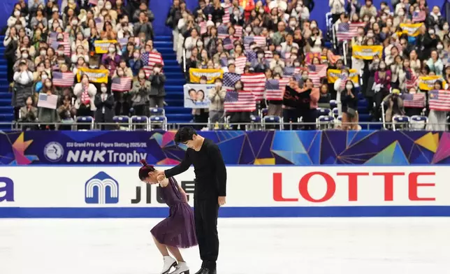 Maia Shibutani and Alex Shibutani, of the U.S., acknowledges the crowd after performing during the ice dance free dance program in the ISU Grand Prix of Figure Skating - NHK Trophy in Kadoma, east of Osaka, western Japan, Saturday, Nov. 8, 2025. (AP Photo/Hiro Komae)