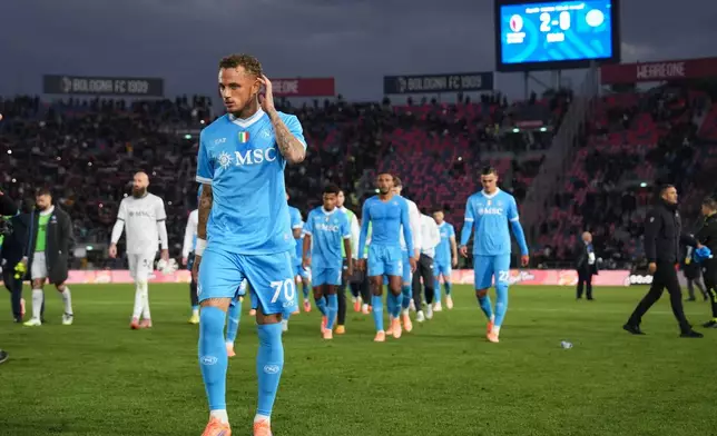 Napoli's Noa Lang and teammates leva the pitch at the end of a Serie A soccer match between Bologna and Napoli, in Bologna, northern Italy, Sunday, Nov. 9, 2025. (Massimo Paolone/LaPresse via AP)