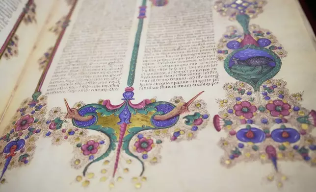A detail is photographed from a reproduction of the 15th century Borso D'Este Bible, comprising two illuminated manuscripts, during its unveiling at the Italian Senate as part of the Vatican's Holy Year celebrations in Rome, Thursday, Nov. 13, 2025. (AP Photo/Alessandra Tarantino)