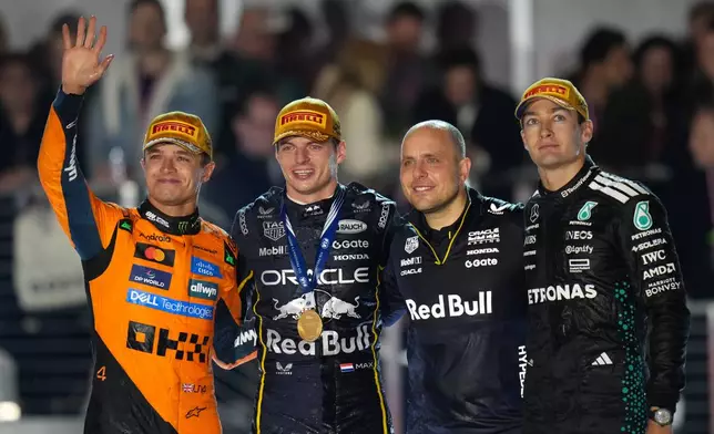 From left, second place finisher McLaren driver Lando Norris of Great Britain, first place finisher Red Bull driver Max Verstappen of the Netherlands, Verstappen's chief race engineer Gianpiero Lambiase, and third place finisher Mercedes driver George Russell of Great Britain celebrate after the Formula One Las Vegas Grand Prix auto race, Saturday, Nov. 22, 2025 in Las Vegas. during the Formula One Las Vegas Grand Prix auto race, Saturday, Nov. 22, 2025 in Las Vegas. (AP Photo/Nick Didlick)