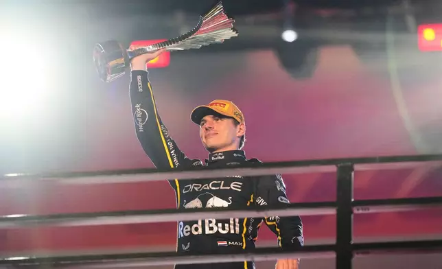 First place finisher Red Bull driver Max Verstappen of the Netherlands celebrates after the Formula One Las Vegas Grand Prix auto race, Saturday, Nov. 22, 2025 in Las Vegas. (AP Photo/Eric Gay)