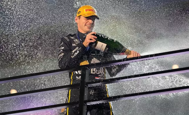 First place finisher Red Bull driver Max Verstappen of the Netherlands celebrates during the Formula One Las Vegas Grand Prix auto race, Saturday, Nov. 22, 2025 in Las Vegas. (AP Photo/John Locher)