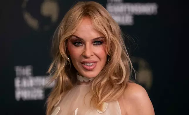 Australian singer Kylie Minogue poses for photos on the green carpet before the Earthshot Prize award ceremony at the Museum of Tomorrow in Rio de Janeiro, Wednesday, Nov. 5, 2025. (AP Photo/Bruna Prado)