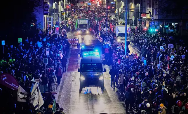 People demonstrate against the planned re-founding of the AfD youth organization in Giessen, Germany, early Saturday, Nov. 29, 2025. (AP Photo/Martin Meissner)