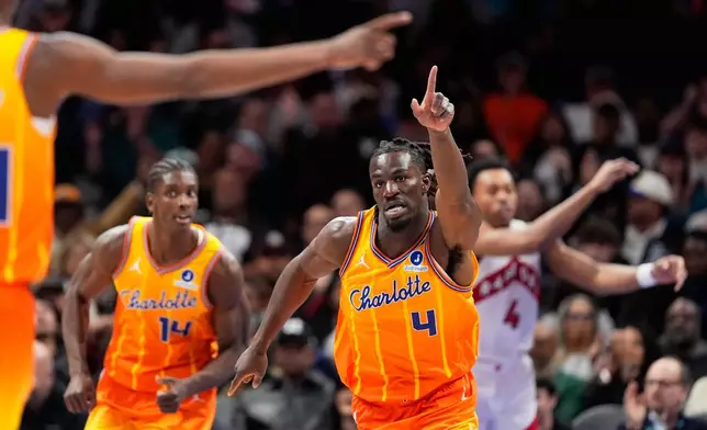 Charlotte Hornets guard Sion James celebrates after scoring against the Toronto Raptors during the first half of an NBA basketball game, Saturday, Nov. 29, 2025, in Charlotte, N.C. (AP Photo/Chris Carlson)