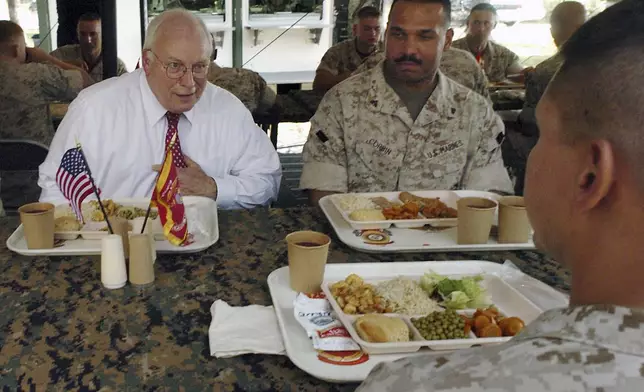 FILE- Vice President Dick Cheney talks with a Marine and Cpl. Todd J. Corbin, right, of Sandusky Ohio, during a luncheon with marines from the 3rd Battalion, 25th Marine Regiment in an outdoor field house on Monday, Oct. 3, 2005 at Camp Lejeune, NC. (AP Photo/Sara D. Davis, file)