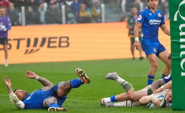 South Africa's Morne Van Den Berg, right, scores a try during the rugby union Nations Series match between Italy and South Africa, in Turin, Italy, Saturday, Nov. 15, 2025. (AP Photo/Luca Bruno)