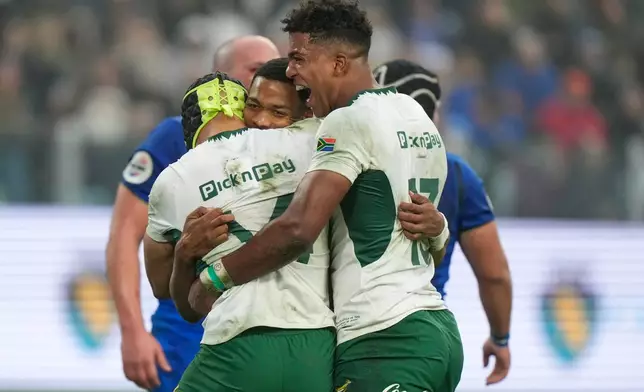 South Africa's Grant Williams, center, reacts after scoring a try during the rugby union Nations Series match between Italy and South Africa, in Turin, Italy, Saturday, Nov. 15, 2025. (AP Photo/Luca Bruno)