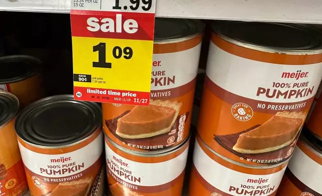 Cans of pumpkin are on display at a Meijer store Friday, Nov. 21, 2025, in Canton Township, Mich. (AP Photo/Mike Householder) _