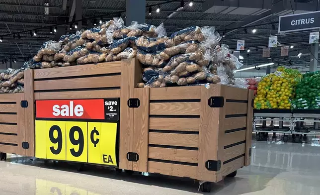 Potatoes are on display at a Meijer store Friday, Nov. 21, 2025, in Canton Township, Mich. (AP Photo/Mike Householder)
