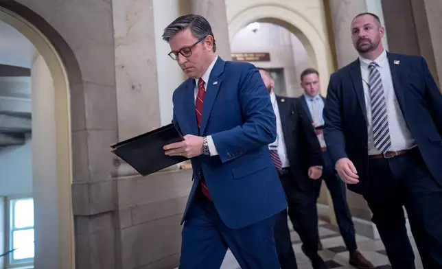 Speaker of the House Mike Johnson, R-La., heads from his office to the chamber for the final vote to bring the longest government shutdown in history to an end, at the Capitol in Washington, Wednesday, Nov. 12, 2025. (AP Photo/J. Scott Applewhite)