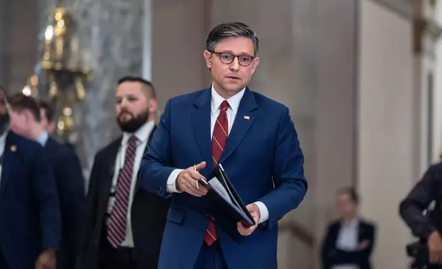 Speaker of the House Mike Johnson, R-La., walks from the chamber to speak with reporters after the final vote to bring the longest government shutdown in history to an end, at the Capitol in Washington, Wednesday, Nov. 12, 2025. (AP Photo/J. Scott Applewhite)