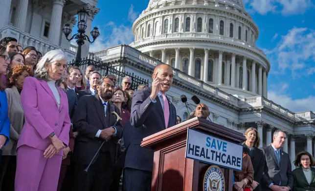 House Minority Leader Hakeem Jeffries, D-N.Y., and fellow Democrats speak on the health care funding fight on the steps of the House before votes to end the government shutdown, at the Capitol in Washington, Wednesday, Nov. 12, 2025. (AP Photo/J. Scott Applewhite)