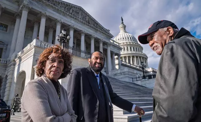 From left, Rep. Maxine Waters, D-Calif., Rep. Al Green, D-Texas, and Rep. Danny Davis, D-Ill., talk on the steps of the House of Representatives before votes to end the government shutdown, at the Capitol in Washington, Wednesday, Nov. 12, 2025. (AP Photo/J. Scott Applewhite)