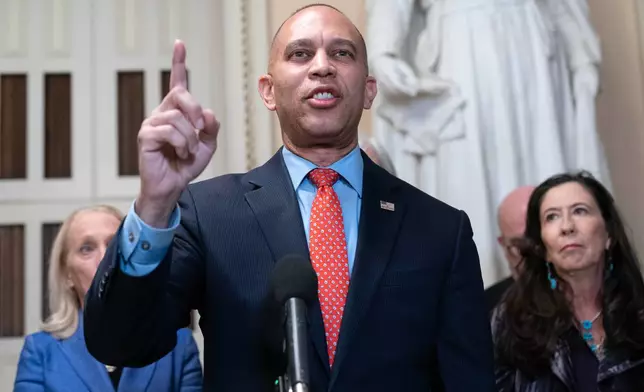 House Minority Leader Hakeem Jeffries, D-N.Y., talks to reporters a day before the House prepares to vote on a bill to reopen the government at the Capitol in Washington, Tuesday, Nov. 11, 2025. (AP Photo/Jose Luis Magana)