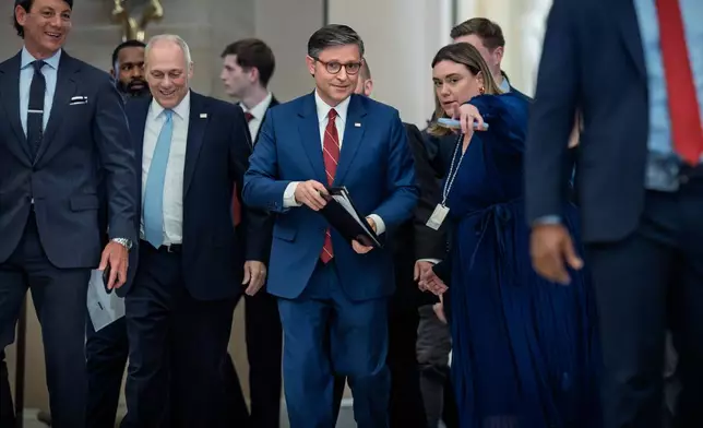 Speaker of the House Mike Johnson, R-La., joined at left by Majority Leader Steve Scalise, R-La., arrives to speak with reporters after the final vote to bring the longest government shutdown in history to an end, at the Capitol in Washington, Wednesday, Nov. 12, 2025. (AP Photo/J. Scott Applewhite)