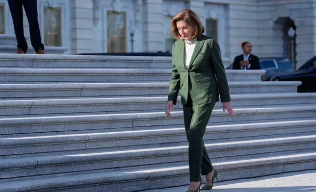 Speaker Emerita Nancy Pelosi, D-Calif., who has announced she will not seek reelection to the U.S. House, walks to join fellow Democrats at an event on the health care fight on the steps of the House before votes to end the government shutdown, at the Capitol in Washington, Wednesday, Nov. 12, 2025. (AP Photo/J. Scott Applewhite)