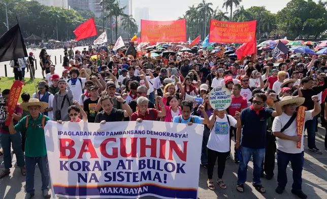 Protesters shout slogans during anti-corruption protest in Manila, Philippines on Sunday Nov. 30, 2025. (AP Photo/Aaron Favila)