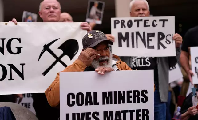Gary Hairston, president of the Fayette County Black Lung Association and the National Black Lung Association, wipes tears from his eyes during a protest outside the U.S. Department of Labor, Oct. 14, 2025, in Washington. (AP Photo/Carolyn Kaster)