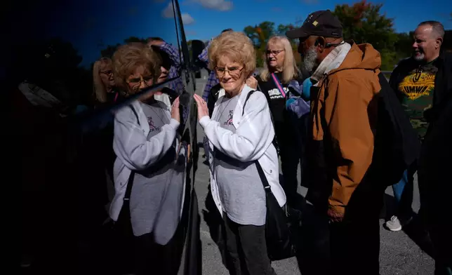 Judy Riffe, president of the Wyoming County Black Lung Association, left, and Gary Hairston, president of the Fayette County Black Lung Association and the National Black Lung Association, second from right, load into a van departing for Washington, D.C., to protest the government's delay of the silica rule passed last year to limit exposure to deadly silica in coal mines, on Oct. 13, 2025, in Mount Hope, W.Va. (AP Photo/Carolyn Kaster)