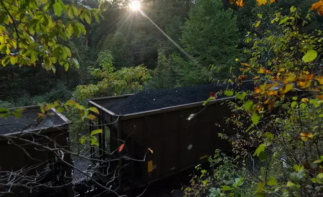 A train car carrying coal moves through Oak Hill, W.Va, at sunset on Sept. 17, 2025. (AP Photo/Carolyn Kaster)