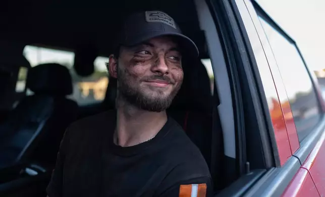 Coal miner Ethan Carper sits in his truck outside a convenience store after work, Sept. 17, 2025, in Oak Hill, W.Va. (AP Photo/Carolyn Kaster)