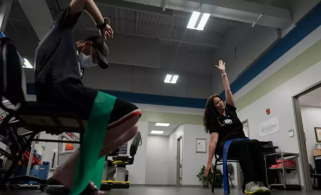 Lisa Emery, director of the New River Health Association Black Lung Clinic, right, works with a patient with black lung disease, Sept. 23, 2025, in Oak Hill, W.Va. (AP Photo/Carolyn Kaster)