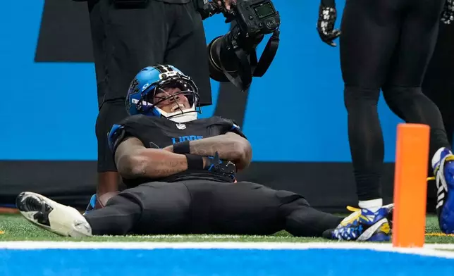 Detroit Lions running back Jahmyr Gibbs reacts after a long run against the New York Giants during the first half of an NFL football game in Detroit, Sunday, Nov. 23, 2025. (AP Photo/Ryan Sun)
