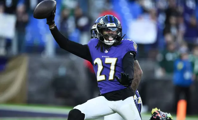 Baltimore Ravens cornerback T.J. Tampa (27) reacts after intercepting the football during the second half of an NFL football game against the New York Jets, Sunday, Nov. 23, 2025, in Baltimore. (AP Photo/Nick Wass)