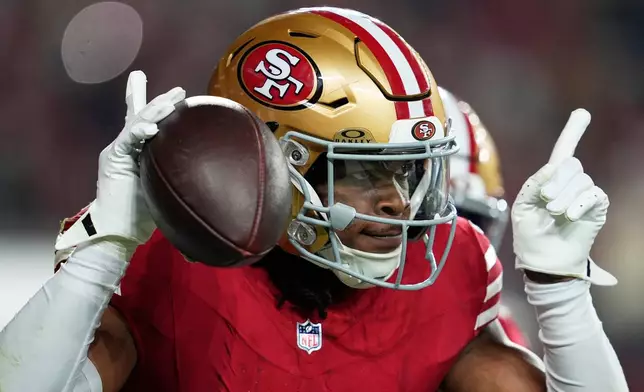 San Francisco 49ers safety Ji'Ayir Brown celebrates after an interception against the Carolina Panthers during the second half an NFL football game, Monday, Nov. 24, 2025, in Santa Clara, Calif. (AP Photo/Godofredo A. Vásquez)