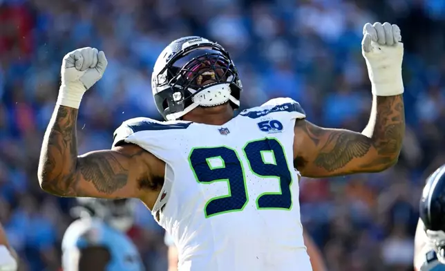 Seattle Seahawks defensive end Leonard Williams celebrates after sacking Tennessee Titans quarterback Cam Ward during the second half of an NFL football game Sunday, Nov. 23, 2025, in Nashville, Tenn. (AP Photo/John Amis)