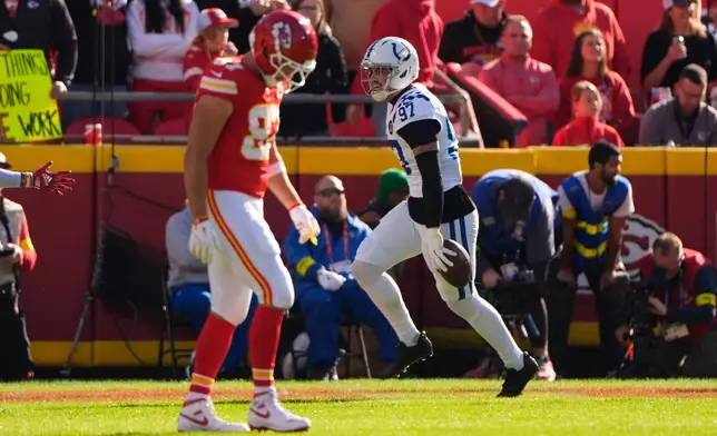 Indianapolis Colts defensive end Laiatu Latu (97) celebrates after an interception against the Kansas City Chiefs during the first half of an NFL football game Sunday, Nov. 23, 2025, in Kansas City, Mo. (AP Photo/Charlie Riedel)