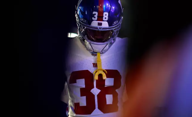New York Giants cornerback Korie Black (38) walks out of the tunnel before an NFL football game against the Detroit Lions in Detroit, Sunday, Nov. 23, 2025. (AP Photo/Rey Del Rio)
