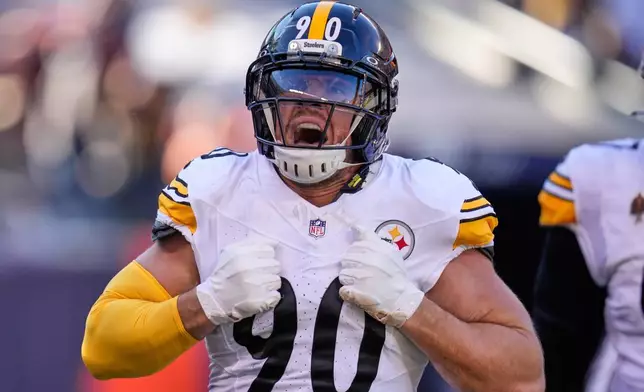 Pittsburgh Steelers linebacker T.J. Watt (90) celebrates after sacking Chicago Bears quarterback Caleb Williams, and forcing a fumble, which led to a touchdown, during the first half of an NFL football game Sunday, Nov. 23, 2025, in Chicago. (AP Photo/Erin Hooley)