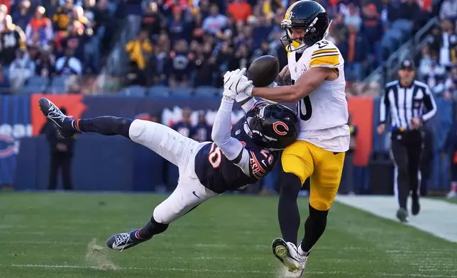 Chicago Bears cornerback Nahshon Wright, left, breaks up a pass in the end zone intended for Pittsburgh Steelers wide receiver Roman Wilson, right, during the second half of an NFL football game Sunday, Nov. 23, 2025, in Chicago. (AP Photo/Nam Huh)