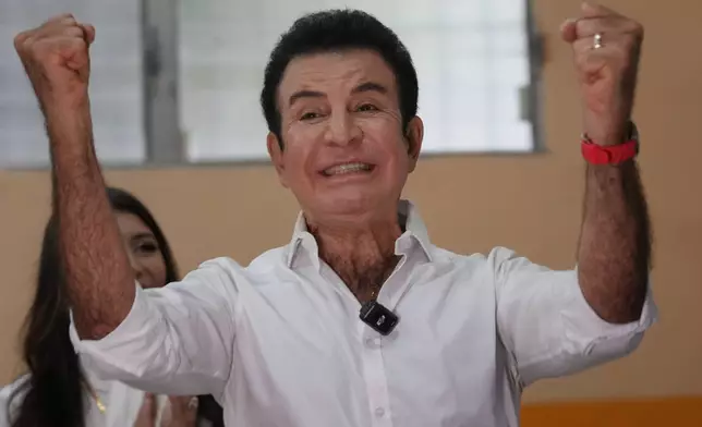 Presidential candidate Salvador Nasralla, of the Liberal Party, celebrates after voting in general elections in Tegucigalpa, Honduras, Sunday, Nov. 30, 2025. (AP Photo/Moises Castillo)