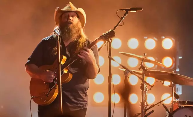 Chris Stapleton performs "Bad As I Used To Be" during the 59th Annual Country Music Association Awards on Wednesday, Nov. 19, 2025, at Bridgestone Arena in Nashville, Tenn. (AP Photo/George Walker IV)
