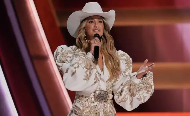 Host Lainey Wilson speaks during the 59th Annual Country Music Association Awards on Wednesday, Nov. 19, 2025, at Bridgestone Arena in Nashville, Tenn. (AP Photo/George Walker IV)
