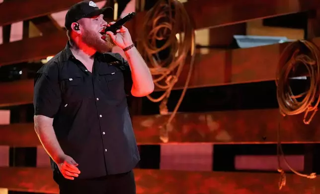 Luke Combs performs "Back in the Saddle" during the 59th Annual Country Music Association Awards on Wednesday, Nov. 19, 2025, at Bridgestone Arena in Nashville, Tenn. (AP Photo/George Walker IV)