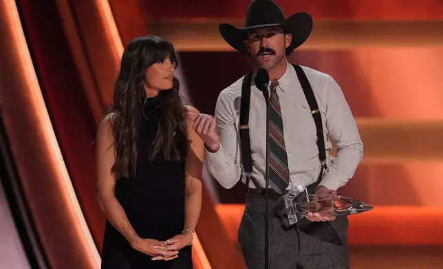 Ella Langley, left, and Riley Green accept the award for song of the year for "You Look Like You Love Me" during the 59th Annual Country Music Association Awards on Wednesday, Nov. 19, 2025, at Bridgestone Arena in Nashville, Tenn. (AP Photo/George Walker IV)