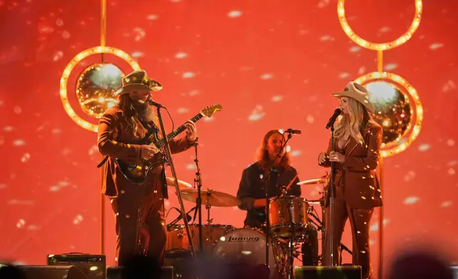 Chris Stapleton, left, and Miranda Lambert perform "A Song To Sing" during the 59th Annual Country Music Association Awards on Wednesday, Nov. 19, 2025, at Bridgestone Arena in Nashville, Tenn. (AP Photo/George Walker IV)