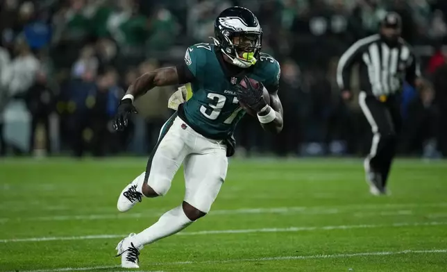 Philadelphia Eagles running back Tank Bigsby (37) runs with the ball during the first half of an NFL football game against the Detroit Lions on Sunday, Nov. 16, 2025, in Philadelphia. (AP Photo/Matt Slocum)