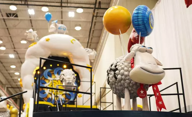 Sheep adorn a float by Serta during a press preview of the new floats at Macy's Parade Studio in Moonachie, N.J., Tuesday, Nov. 18, 2025. (AP Photo/Seth Wenig)