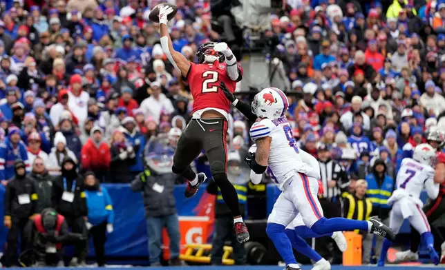 Tampa Bay Buccaneers wide receiver Emeka Egbuka (2) cannot make a catch against Buffalo Bills linebacker Terrel Bernard (8) during the first half of an NFL football game, Sunday, Nov. 16, 2025, in Orchard Park, N.Y. (AP Photo/Carolyn Kaster)
