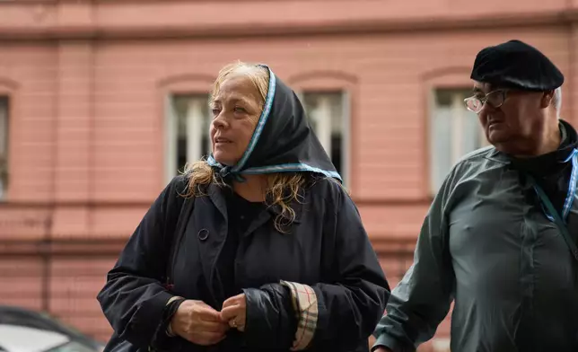 Asuncion Benedit, left, takes part in a protest demanding the release of former servicemen accused of human rights violations during the last dictatorship, in Buenos Aires, Argentina, Saturday, Nov. 29, 2025. (AP Photo/Rodrigo Abd)