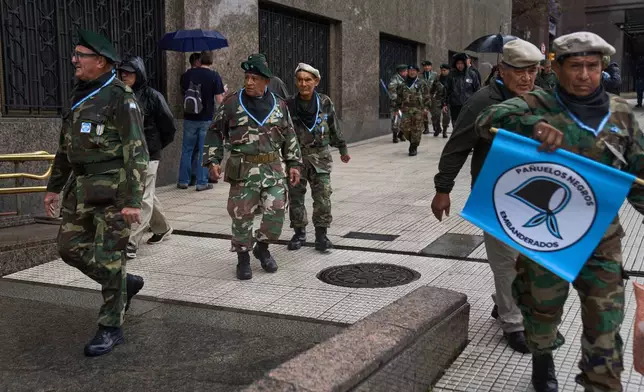 Retired military personnel gather to call for the release of former servicemen accused of human rights violations during the last dictatorship, in Buenos Aires, Argentina, Saturday, Nov. 29, 2025. (AP Photo/Rodrigo Abd)